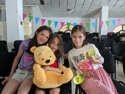 Maris with her new friends Ema and Naida at summer camp
