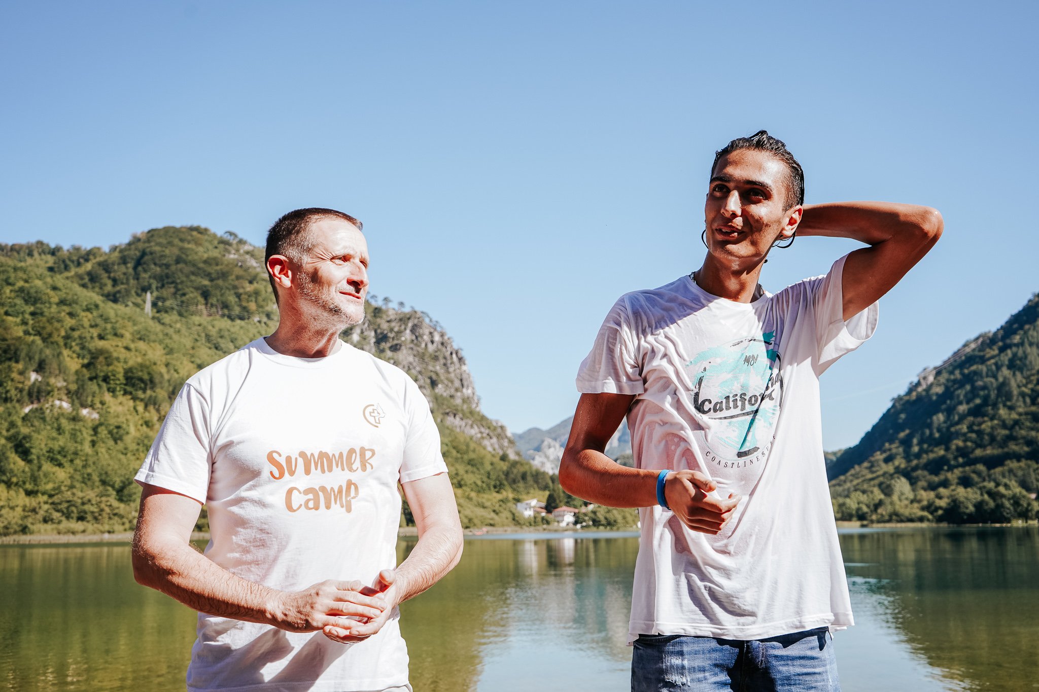 Orhan coming out of the lake with MWB Director and pastor, Dalibor Kojik