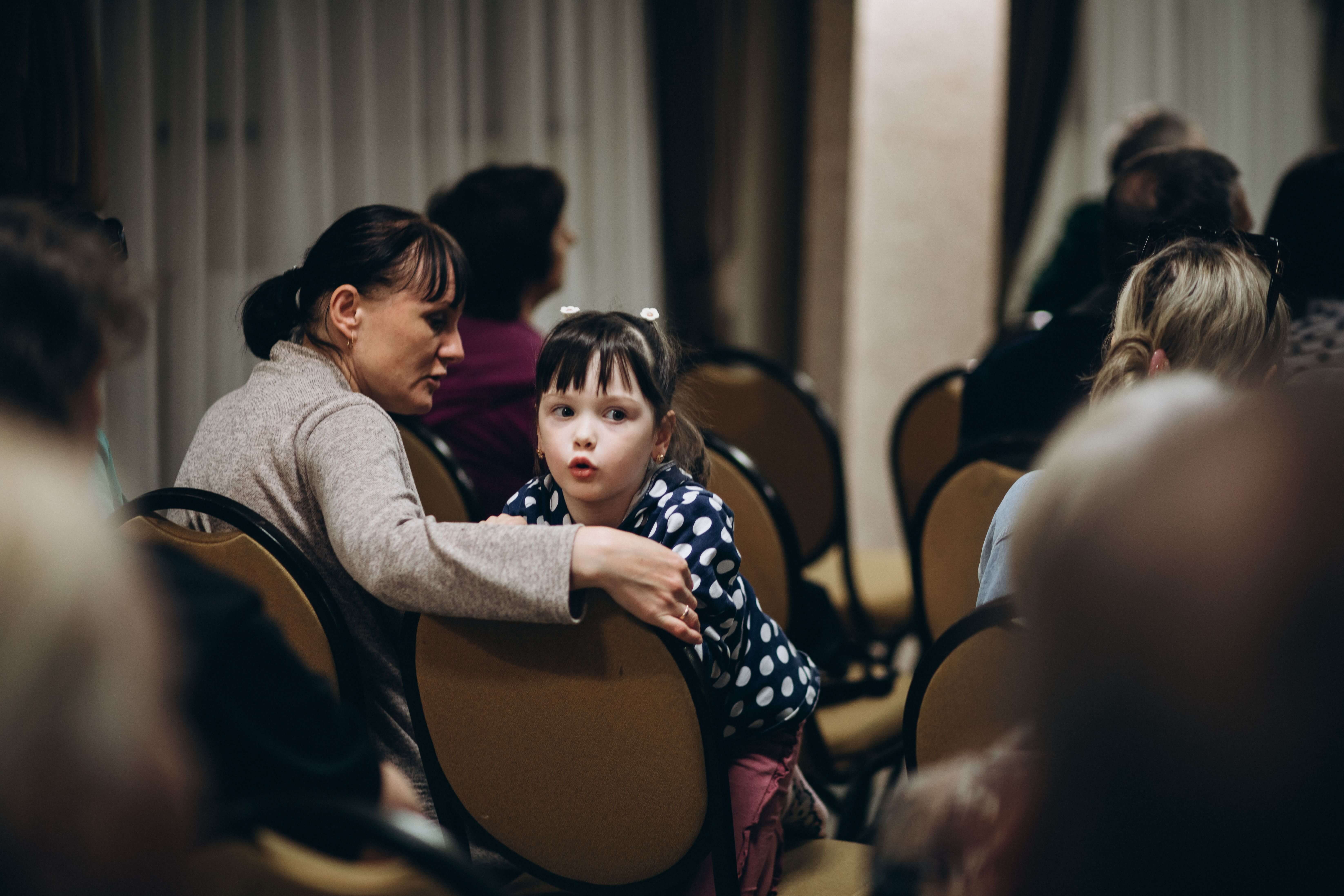 A mother and daughter attend meeting regularly where they receive support and aid from MWB