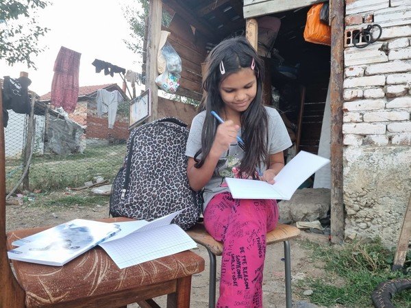 Yamur studying outside her home in Bulgaria