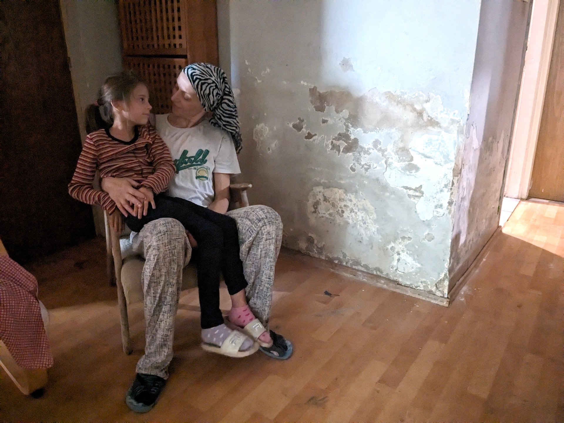 Maris with her mother, Iva, in their home in Bosnia and Herzegovina 