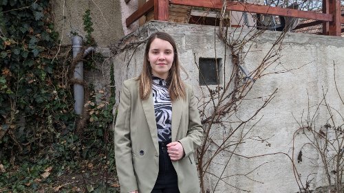 Melisa outside her home in Romania